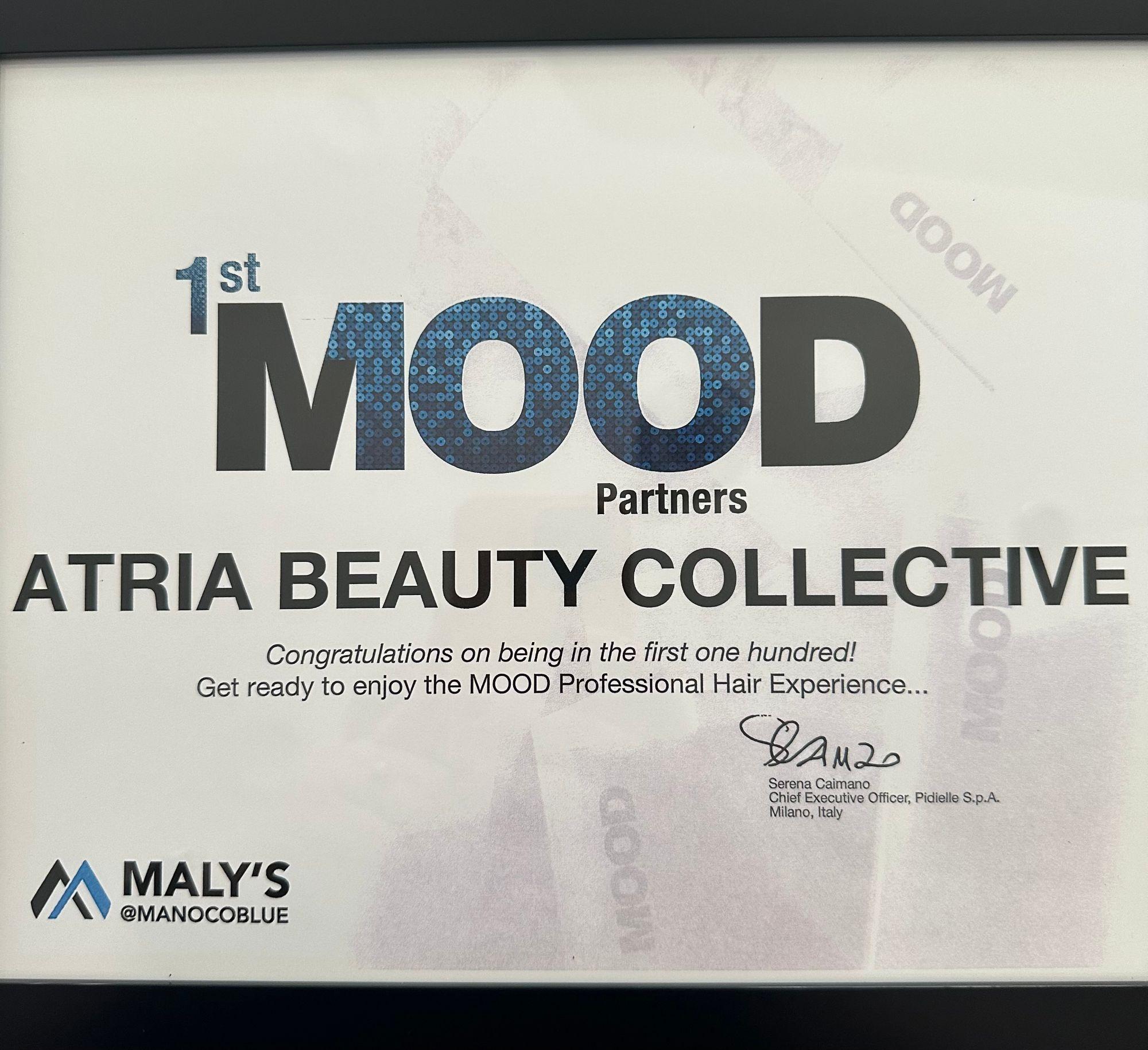 Framed certificate naming Atria Beauty Collective among the first one hundred Mood partner salons.