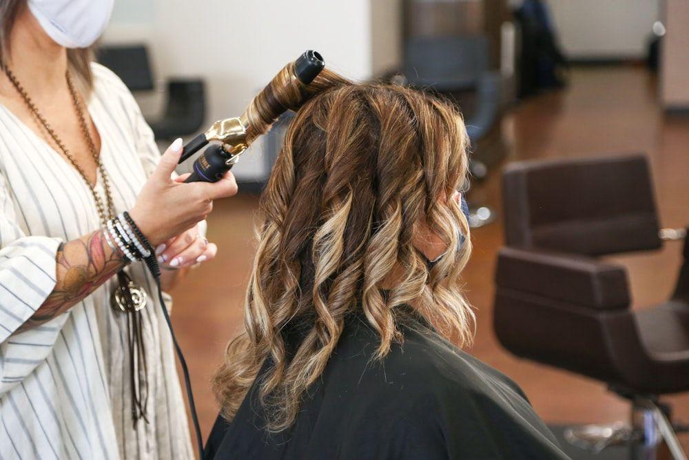 Stylist hand-painting balayage color