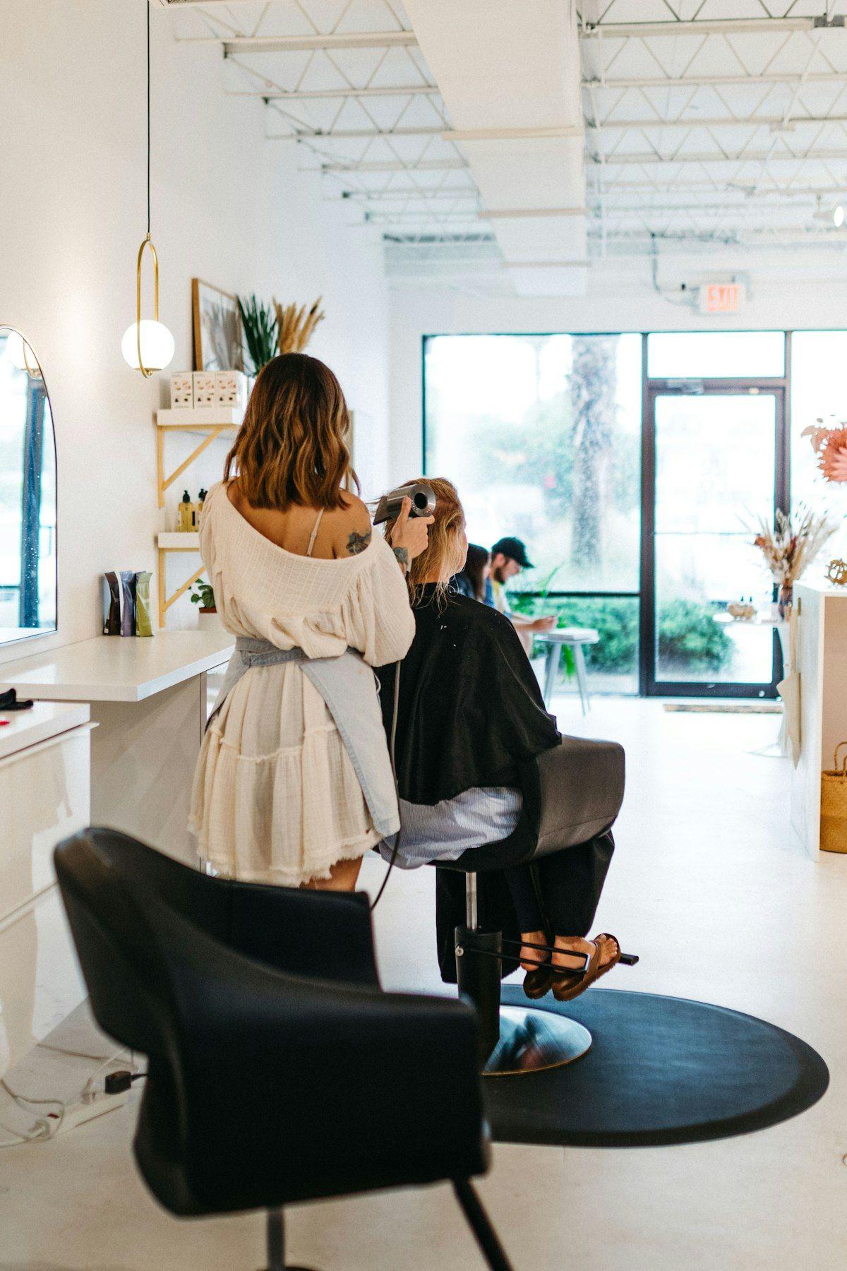 A stylist at work in a bright, modern salon