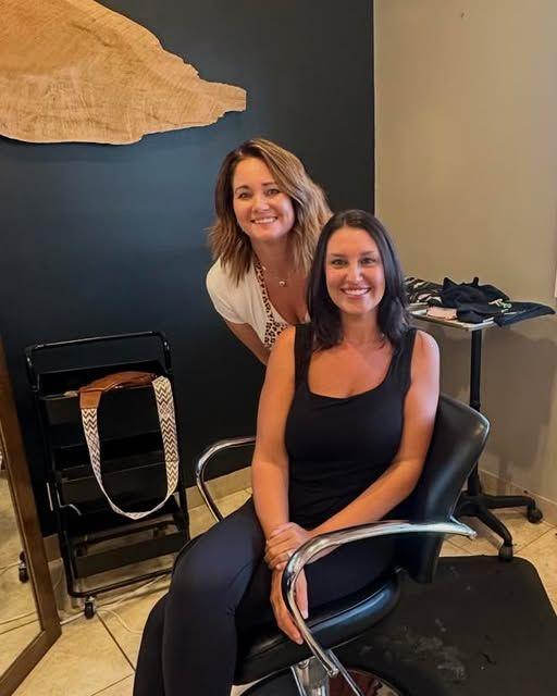 An Atria stylist with a happy guest