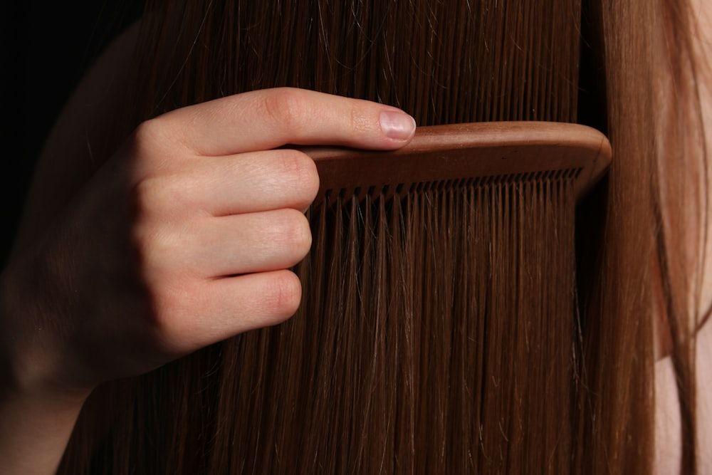 Combing through healthy, glossy hair